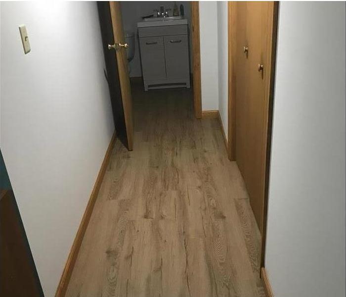 new wood floor, walls, and fixtures in the bathroom