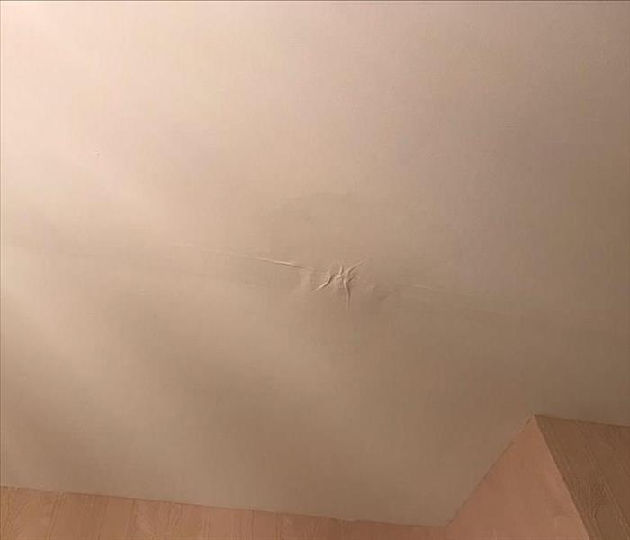 white ceiling showing paint blistering